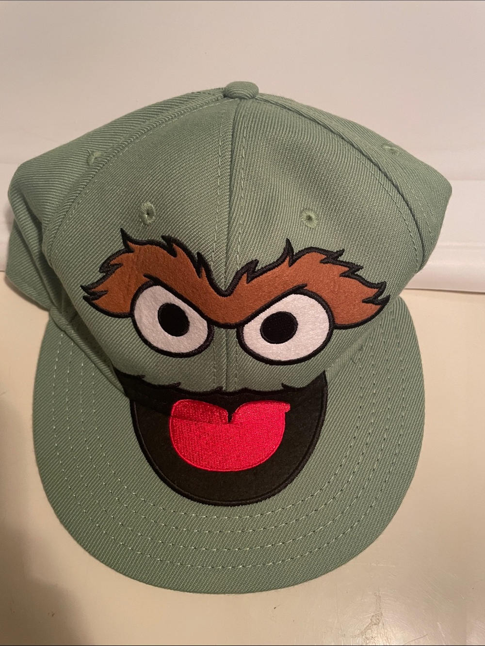 Sesame Street Oscar The Grouch Green Cap with Orange Patterned Lining